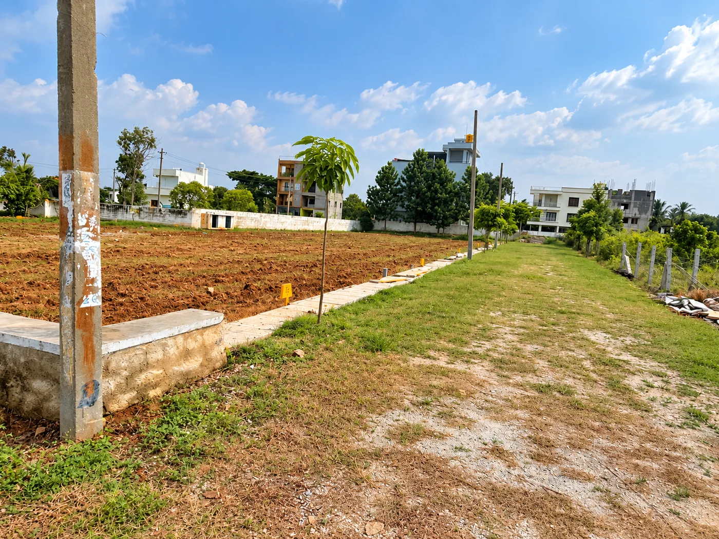 Underground utilities and wide internal asphalt road view at Gathyri Enclave Rajanukunte