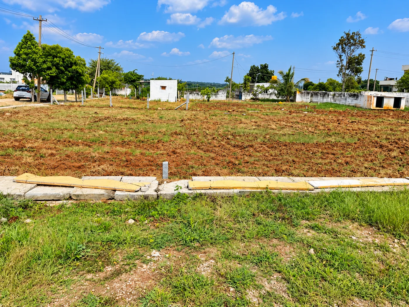 Residential villa plot ready for immediate construction with clear boundary markers at Gathyri Enclave